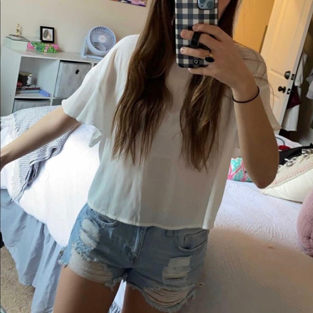 Vestique white top with open back